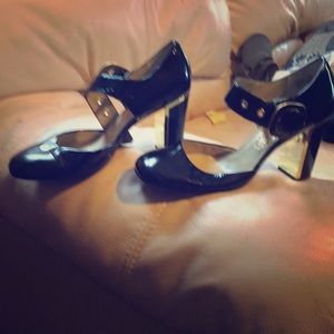 Ash black pumps with gold trim buckle